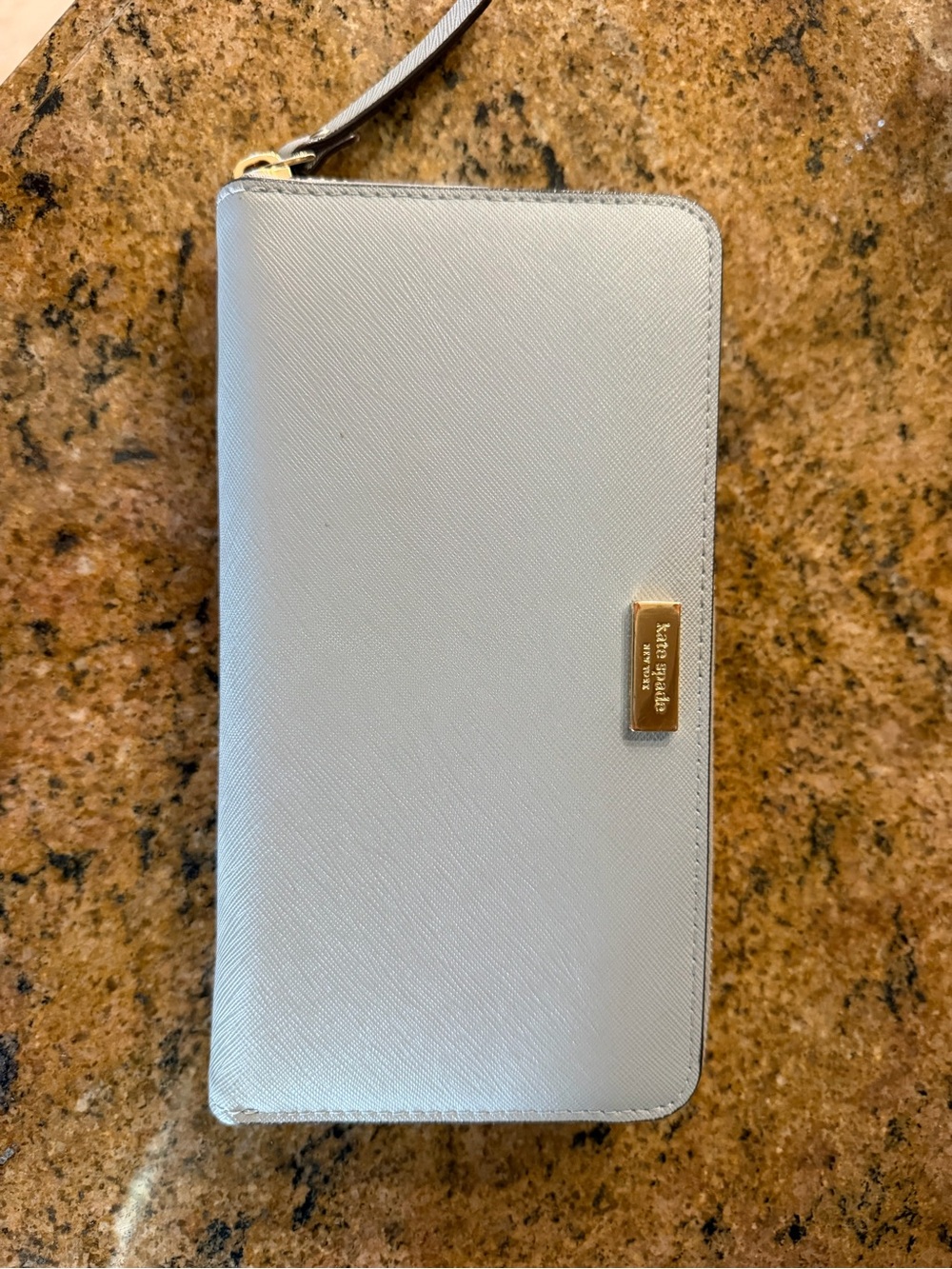 kate spade pale blue zip-around wristlet with gold plaque
